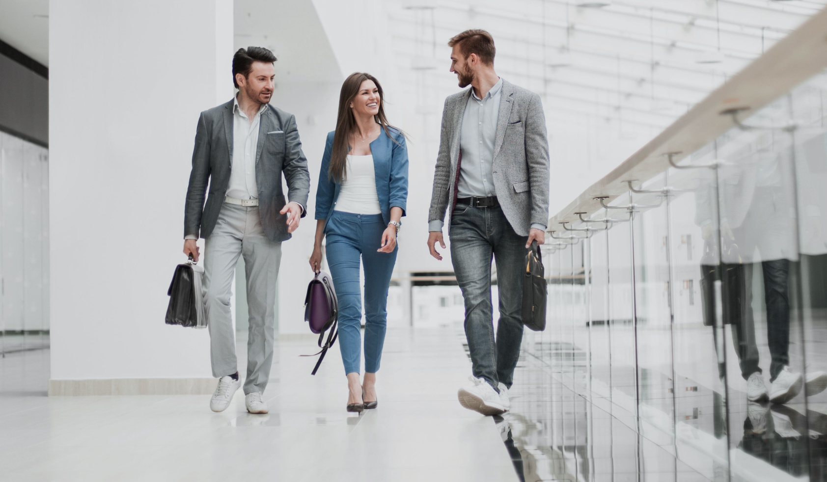 visitors walk in the lobby of the business center